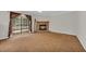 Inviting living area featuring a stone fireplace and direct access to a screened porch at 203 Warbler St., Georgetown, SC 29440