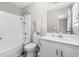 Bathroom featuring a shower/tub combo with a white vanity and mirror at 204 Elm St., Johnsonville, SC 29555
