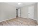 Bedroom with wood-look floors, fresh paint, and white trim at 204 Elm St., Johnsonville, SC 29555