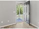 Interior shot of a front door with the house number 204, opening to a covered porch at 204 Elm St., Johnsonville, SC 29555