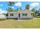 Charming single story home with a inviting front porch, black shutters, and brick foundation at 204 Elm St., Johnsonville, SC 29555