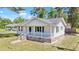 Charming single story home with a inviting front porch, black shutters, and brick foundation at 204 Elm St., Johnsonville, SC 29555