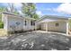 Backyard featuring a covered carport attached to the house with concrete pad at 204 Elm St., Johnsonville, SC 29555