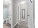 Hallway with a view of the nearby bathroom and a full length mirror on the wall at 204 Elm St., Johnsonville, SC 29555