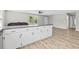 Kitchen with breakfast bar overlooking a living area, and featuring modern flooring at 204 Elm St., Johnsonville, SC 29555