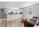 Spacious kitchen featuring an open floor plan, white cabinets, and stainless appliances at 204 Elm St., Johnsonville, SC 29555