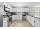 Bright kitchen featuring modern appliances, white cabinetry and gray countertops at 204 Elm St., Johnsonville, SC 29555