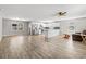 Open concept living area featuring modern flooring, gray walls, stainless appliances, and a breakfast bar at 204 Elm St., Johnsonville, SC 29555