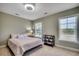 Bedroom with two large windows and neutral color palette at 205 Threshing Way # 1052, Myrtle Beach, SC 29579
