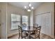 Charming dining area featuring natural light, a modern chandelier, and storage at 205 Threshing Way # 1052, Myrtle Beach, SC 29579