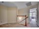 Upstairs hallway with carpet and access to a bedroom at 205 Threshing Way # 1052, Myrtle Beach, SC 29579