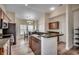 Well-lit kitchen boasts stainless appliances, ample cabinet space, and a breakfast bar at 205 Threshing Way # 1052, Myrtle Beach, SC 29579