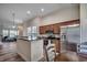 Well-lit kitchen featuring stainless steel appliances and a breakfast bar overlooking the living room at 205 Threshing Way # 1052, Myrtle Beach, SC 29579