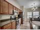Bright kitchen featuring stainless steel appliances, wood cabinets, and an eat-in area at 205 Threshing Way # 1052, Myrtle Beach, SC 29579