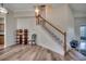 Inviting living room featuring hardwood floors, staircase, and open space at 205 Threshing Way # 1052, Myrtle Beach, SC 29579