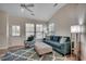 Spacious living area with an accent chair, a ceiling fan, and plenty of sunlight at 205 Threshing Way # 1052, Myrtle Beach, SC 29579
