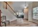 Bright living area showcasing vaulted ceilings, wood floors and a staircase leading upstairs at 205 Threshing Way # 1052, Myrtle Beach, SC 29579