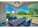 Screened porch with beautiful outdoor views and seating area at 205 Threshing Way # 1052, Myrtle Beach, SC 29579