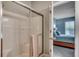 Glass door shower with a tiled wall and a view into a bedroom at 205 Threshing Way # 1052, Myrtle Beach, SC 29579