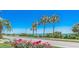 Charming street view with palm trees and colorful flowers, showcasing a vibrant community near the beach at 205 Threshing Way # 1052, Myrtle Beach, SC 29579