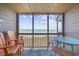 Relaxing covered balcony overlooking the ocean features comfortable seating at 208 Ocean Blvd. N # 324, North Myrtle Beach, SC 29582