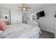 Bright bedroom features a queen bed, TV, ceiling fan and is decorated with beach-themed decorations at 208 Ocean Blvd. N # 324, North Myrtle Beach, SC 29582