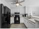 Well-equipped kitchen with modern black appliances and white cabinetry at 208 Ocean Blvd. N # 324, North Myrtle Beach, SC 29582