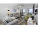 Cozy living room with beach-themed decor and sliding glass doors to the balcony at 208 Ocean Blvd. N # 324, North Myrtle Beach, SC 29582