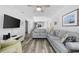 Bright living room features stylish, comfortable seating and modern entertainment center at 208 Ocean Blvd. N # 324, North Myrtle Beach, SC 29582