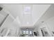 Bright living room with vaulted ceiling and ocean view balcony access at 208 Ocean Blvd. N # 324, North Myrtle Beach, SC 29582