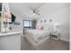 Relax in this updated main bedroom with a ceiling fan, balcony access and charming decor at 208 Ocean Blvd. N # 324, North Myrtle Beach, SC 29582