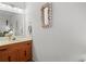 A charming bathroom vanity featuring a mirror decorated with seashells at 210 25Th Ave. S # 19, Myrtle Beach, SC 29577