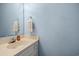 A vanity in the blue painted bathroom at 210 25Th Ave. S # 19, Myrtle Beach, SC 29577