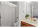 Traditional bathroom featuring a shower with curtain and wood vanity at 210 25Th Ave. S # 19, Myrtle Beach, SC 29577
