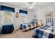 Charming bedroom with two twin beds, blue accents, and plenty of natural light from two windows at 210 25Th Ave. S # 19, Myrtle Beach, SC 29577