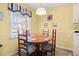 A bright dining room with a round wooden table at 210 25Th Ave. S # 19, Myrtle Beach, SC 29577