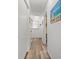 Hallway with luxury vinyl plank flooring and coastal-themed artwork at 210 25Th Ave. S # 19, Myrtle Beach, SC 29577