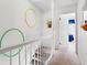 Hallway with carpeted stairs and doorway to a bedroom with blue accents at 210 25Th Ave. S # 19, Myrtle Beach, SC 29577