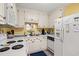 The kitchen has a white fridge and a cute view from the window at 210 25Th Ave. S # 19, Myrtle Beach, SC 29577