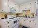 The kitchen is equipped with white appliances and cabinets at 210 25Th Ave. S # 19, Myrtle Beach, SC 29577