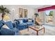 Cozy living room with denim furniture, nautical decor, and sliding glass doors to outdoor space at 210 25Th Ave. S # 19, Myrtle Beach, SC 29577