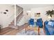 Comfortable living room with adjacent stairway featuring denim furniture and beach-themed decorations at 210 25Th Ave. S # 19, Myrtle Beach, SC 29577