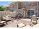 Relaxing outdoor patio area with comfortable seating, a privacy fence, and inviting brick pavers at 210 25Th Ave. S # 19, Myrtle Beach, SC 29577