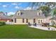 Expansive backyard with lush lawn and patio featuring an outdoor seating area at 2150 North Berwick Dr., Myrtle Beach, SC 29575
