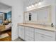 Well-lit bathroom with double sinks, granite countertops, decorative mirrors and stylish tile flooring at 2150 North Berwick Dr., Myrtle Beach, SC 29575
