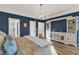 Charming bedroom with blue walls, hardwood floors, elegant lighting, and a decorative furniture piece at 2150 North Berwick Dr., Myrtle Beach, SC 29575