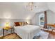 Charming bedroom featuring a bright arched window, accent lighting, and hardwood floors at 2150 North Berwick Dr., Myrtle Beach, SC 29575