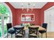 Elegant dining room with wood table, stylish chairs, and decorative chandelier at 2150 North Berwick Dr., Myrtle Beach, SC 29575
