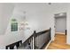 Open hallway featuring hardwood floors, chandelier, a window with natural light, and access to multiple rooms at 2150 North Berwick Dr., Myrtle Beach, SC 29575