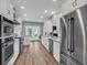 Spacious kitchen with stainless steel appliances and natural hardwood floors at 2150 North Berwick Dr., Myrtle Beach, SC 29575
